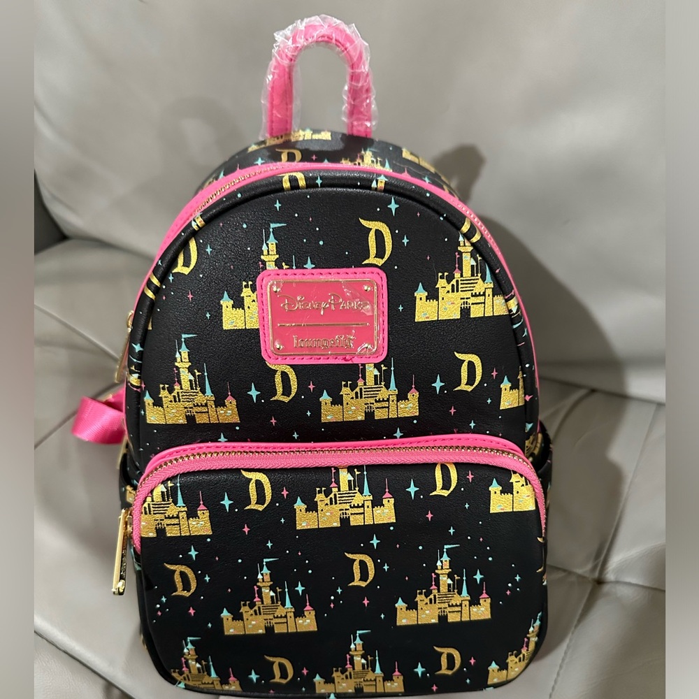 Disney loungefly backpack with Disneyland Sleeping Beauty castle and logo